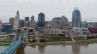 DX0001_002646 - 5.7K aerial stock footage of flying toward the city's downtown skyline across the Ohio River, Downtown Cincinnati, Ohio