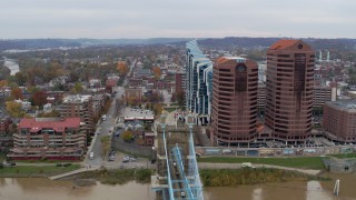 DX0001_002656 - 5.7K aerial stock footage reverse view of city street and condo complex, reveal office buildings in Covington, Kentucky