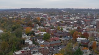 DX0001_002666 - 5.7K aerial stock footage of flying away from brick buildings in downtown, Covington, Kentucky