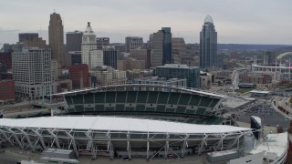 DX0001_002673 - 5.7K aerial stock footage fly away from tall skyscrapers, and flyby football stadium in Downtown Cincinnati, Ohio