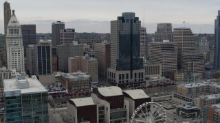 DX0001_002677 - 5.7K aerial stock footage of a reverse view the Scripps Center skyscraper, reveal Ferris wheel in Downtown Cincinnati, Ohio