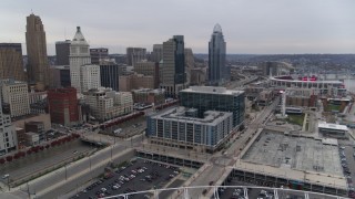 DX0001_002681 - 5.7K aerial stock footage reverse view of apartment and office buildings near skyscrapers seen from the football stadium in Downtown Cincinnati, Ohio