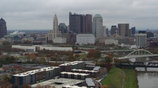DX0001_002699 - 5.7K aerial stock footage descend with view of the city's skyline and the Scioto River in Downtown Columbus, Ohio
