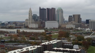 DX0001_002701 - 5.7K aerial stock footage slowly fly away from the city's skyline and the Scioto River in Downtown Columbus, Ohio