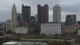 DX0001_002704 - 5.7K aerial stock footage flying by four tall skyscrapers in the city's skyline in Downtown Columbus, Ohio