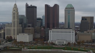 DX0001_002707 - 5.7K aerial stock footage slowly descending by four tall skyscrapers in the city's skyline in Downtown Columbus, Ohio