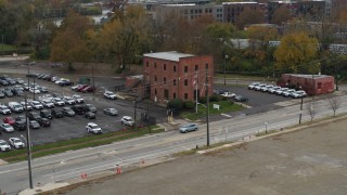 DX0001_002713 - 5.7K aerial stock footage of orbiting around a brick police station in Columbus, Ohio