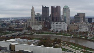 DX0001_002718 - 5.7K aerial stock footage of flying by the city's skyline across the Scioto River, Downtown Columbus, Ohio