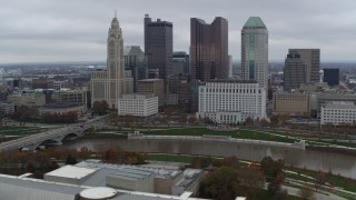 DX0001_002719 - 5.7K aerial stock footage of passing by the city's skyline across the Scioto River, Downtown Columbus, Ohio