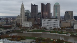 DX0001_002722 - 5.7K aerial stock footage of approaching the Scioto River and the city skyline, Downtown Columbus, Ohio