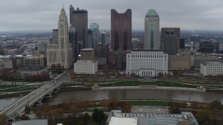 DX0001_002731 - 5.7K aerial stock footage passing the city's skyline and river near Discovery Bridge, Downtown Columbus, Ohio