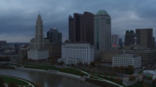 DX0001_002739 - 5.7K aerial stock footage city skyline on the other side of the Scioto River at sunset, Downtown Columbus, Ohio