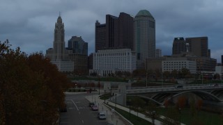 DX0001_002752 - 5.7K aerial stock footage of the city skyline and the Scioto River at sunset during descent, Downtown Columbus, Ohio
