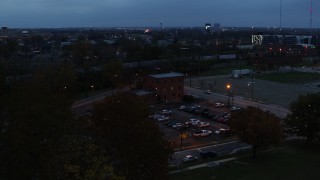 DX0001_002764 - 5.7K aerial stock footage of approaching a brick police station at twilight in Columbus, Ohio