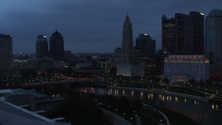 DX0001_002773 - 5.7K aerial stock footage of a reverse view of LeVeque Tower across the river at twilight, Downtown Columbus, Ohio