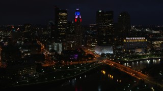 DX0001_002797 - 5.7K aerial stock footage of flying by LeVeque Tower and city skyline at night, Downtown Columbus, Ohio