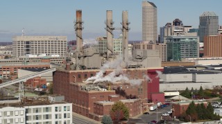 DX0001_002820 - 5.7K stock footage aerial video of flying by brick factory with smoke stacks in Indianapolis, Indiana