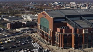 DX0001_002831 - 5.7K aerial stock footage flying by the front of a football stadium in Indianapolis, Indiana