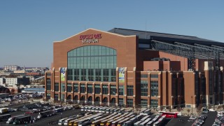 DX0001_002832 - 5.7K aerial stock footage orbiting the front of a football stadium in Indianapolis, Indiana
