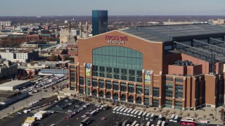 DX0001_002835 - 5.7K aerial stock footage of ascending in front of a football stadium in Indianapolis, Indiana