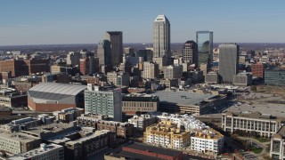 DX0001_002842 - 5.7K aerial stock footage of flying by the city's skyline in Downtown Indianapolis, Indiana