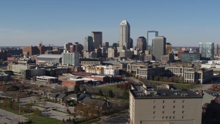 DX0001_002848 - 5.7K aerial stock footage descend and then approach the city's skyline in Downtown Indianapolis, Indiana