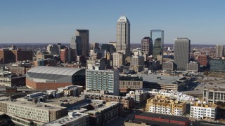 DX0001_002849 - 5.7K aerial stock footage flying by the city's skyline near the arena in Downtown Indianapolis, Indiana