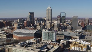 DX0001_002850 - 5.7K aerial stock footage passing by the city's skyline near the arena in Downtown Indianapolis, Indiana