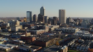 DX0001_002892 - 5.7K aerial stock footage of flying by the skyline in Downtown Indianapolis, Indiana
