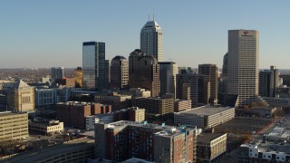 DX0001_002899 - 5.7K aerial stock footage of flying toward the skyline's tall skyscrapers in Downtown Indianapolis, Indiana