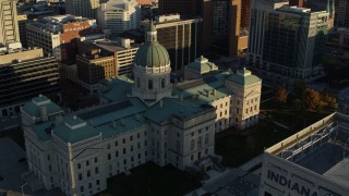 DX0001_002912 - 5.7K aerial stock footage flying by and away from the Indiana State House in Downtown Indianapolis, Indiana