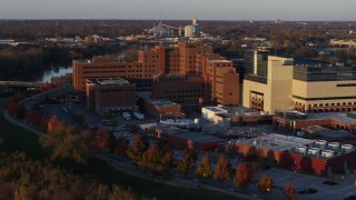 DX0001_002919 - 5.7K stock footage aerial video approach and orbit a VA hospital complex at sunset in Indianapolis, Indiana