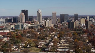 DX0001_002981 - 5.7K stock footage aerial video of slowly flying by the city's skyline, seen from apartment buildings, Downtown Louisville, Kentucky