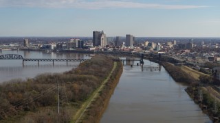DX0001_003000 - 5.7K stock footage aerial video of the city's skyline seen while passing by the river in Downtown Louisville, Kentucky