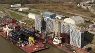 DX0001_003011 - 5.7K stock footage aerial video flyby and away from piers on the Ohio River in Louisville, Kentucky