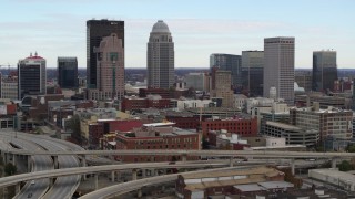 DX0001_003019 - 5.7K aerial stock footage of city skyline seen from freeway offramp in Downtown Louisville, Kentucky