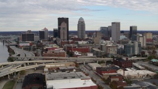 DX0001_003029 - 5.7K stock footage aerial video flyby the city's skyline beside a freeway in Downtown Louisville, Kentucky before approach