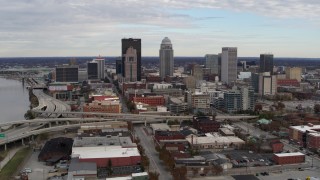 DX0001_003033 - 5.7K aerial stock footage slowly approach tall skyscrapers in city skyline in Downtown Louisville, Kentucky