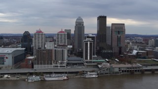 DX0001_003041 - 5.7K aerial stock footage fly away from riverfront hotel and skyline, reveal the river in Downtown Louisville, Kentucky