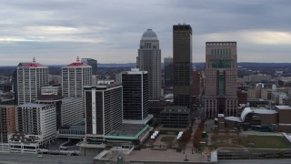 DX0001_003044 - 5.7K stock footage aerial video reverse view of riverfront hotel and the city skyline, reveal the river in Downtown Louisville, Kentucky