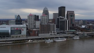 DX0001_003047 - 5.7K stock footage aerial video stationary view of the city skyline beside the Ohio River in Downtown Louisville, Kentucky
