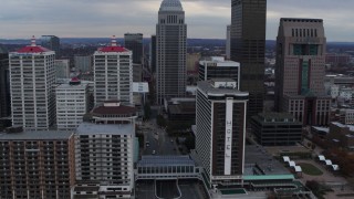 DX0001_003049 - 5.7K aerial stock footage fly over Ohio River to approach skyline and hotel in Downtown Louisville, Kentucky