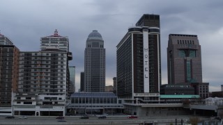 DX0001_003059 - 5.7K aerial stock footage passing hotel with skyscrapers in background, Downtown Louisville, Kentucky