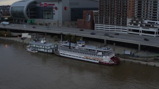 DX0001_003063 - 5.7K stock footage aerial video approach the historic riverboat docked by Downtown Louisville, Kentucky