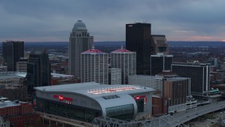 DX0001_003083 - 5.7K stock footage aerial video flyby arena and city skyline at sunset, Downtown Louisville, Kentucky
