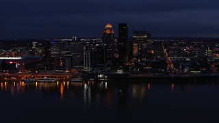 DX0001_003112 - 5.7K aerial stock footage of the city's skyline at twilight, seen from Ohio River, Downtown Louisville, Kentucky