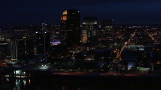 DX0001_003122 - 5.7K aerial stock footage flying by the city's skyline at twilight, Downtown Louisville, Kentucky