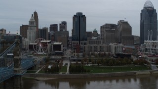 DX0001_003143 - 5.7K aerial stock footage fly over Ohio River to approach tall skyscraper, Downtown Cincinnati, Ohio