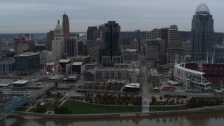 DX0001_003144 - 5.7K aerial stock footage reverse view of tall skyscraper and skyline, reveal Ohio River, Downtown Cincinnati, Ohio