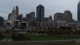DX0001_003147 - 5.7K aerial stock footage of Scripps Center and skyline during descent, Downtown Cincinnati, Ohio